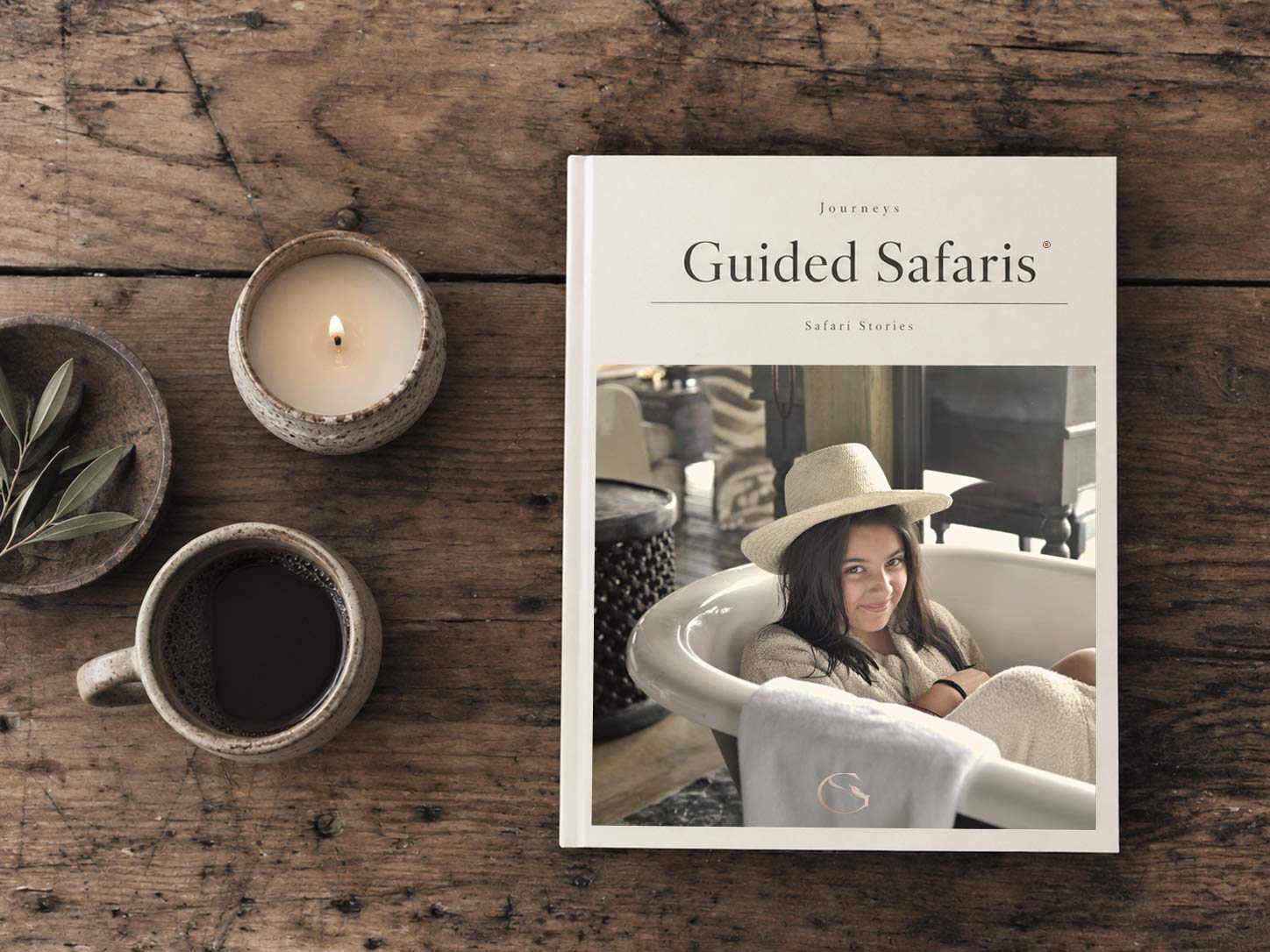 The Guided Safaris® Safari Stories journal on a table, the Dinetz family on its cover